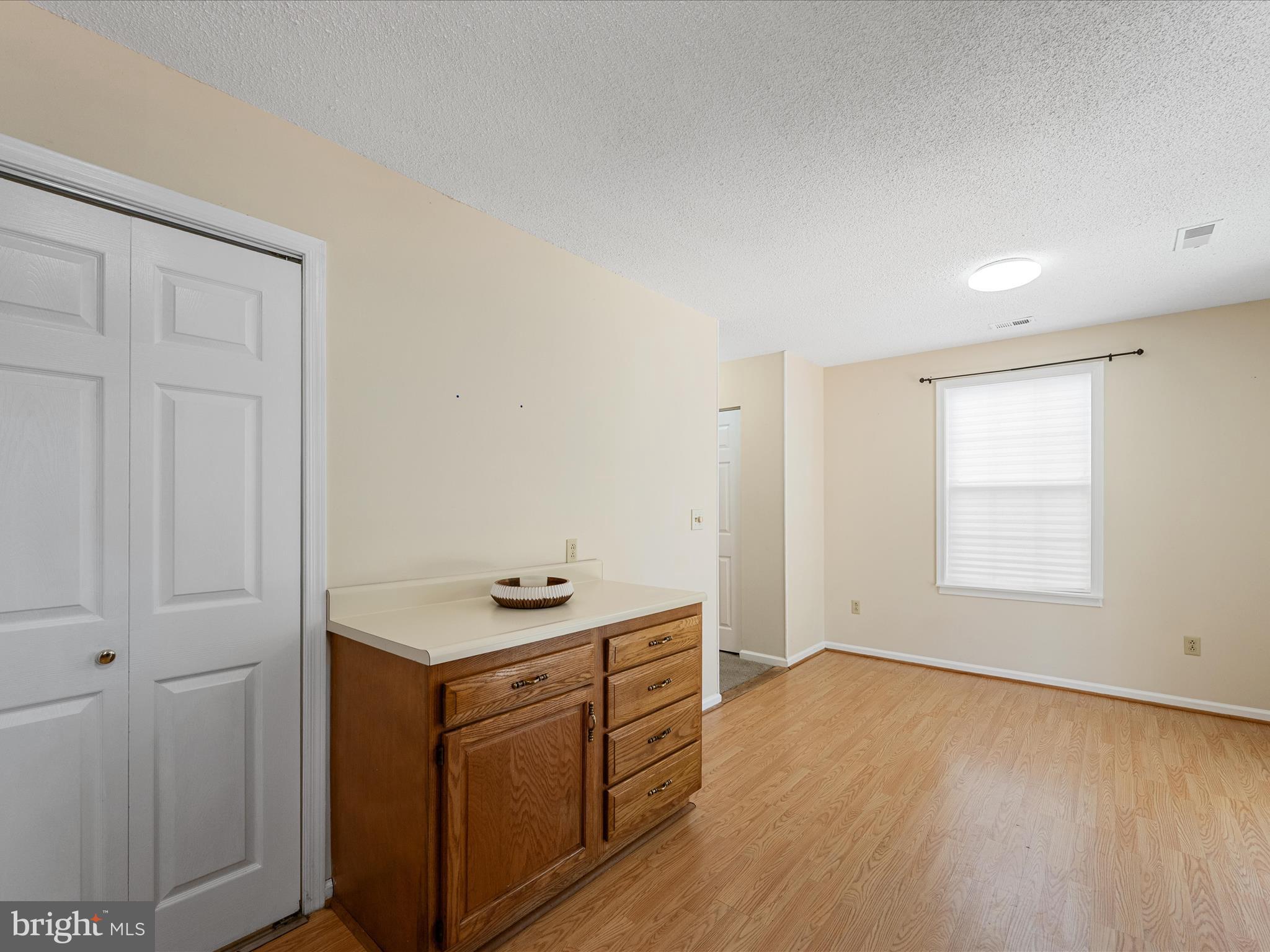 208 South Marshall Street Ranson, WV 25438 - Photo 11 of 28 an empty room with wooden floor