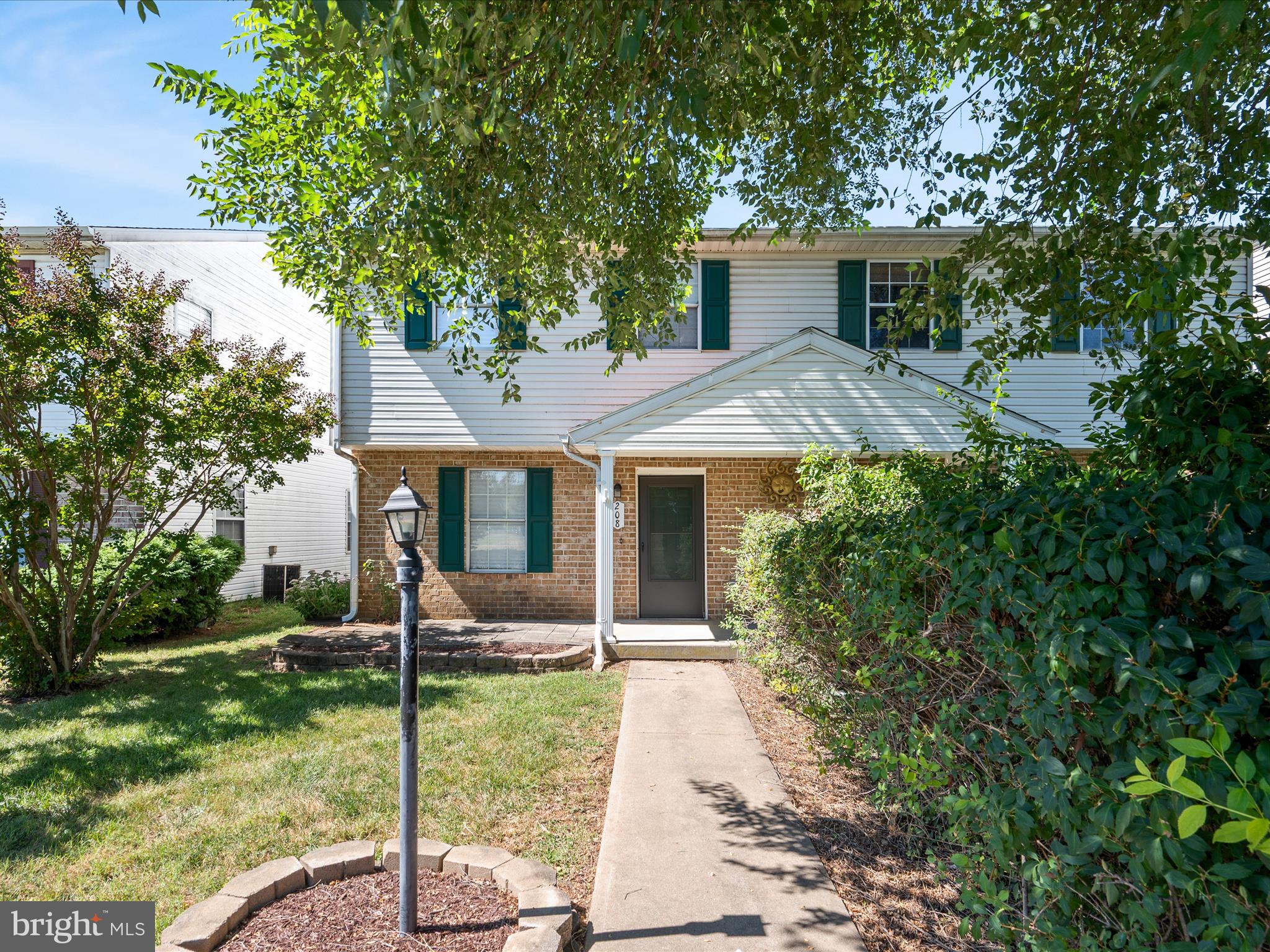 208 South Marshall Street Ranson, WV 25438 - Photo 21 of 28 a front view of house with yard and green space