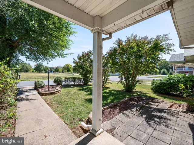 a view of a backyard with sitting area