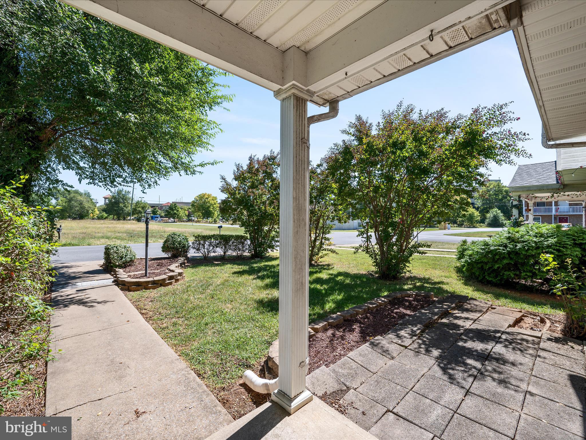 208 South Marshall Street Ranson, WV 25438 - Photo 22 of 28 a view of a backyard with sitting area