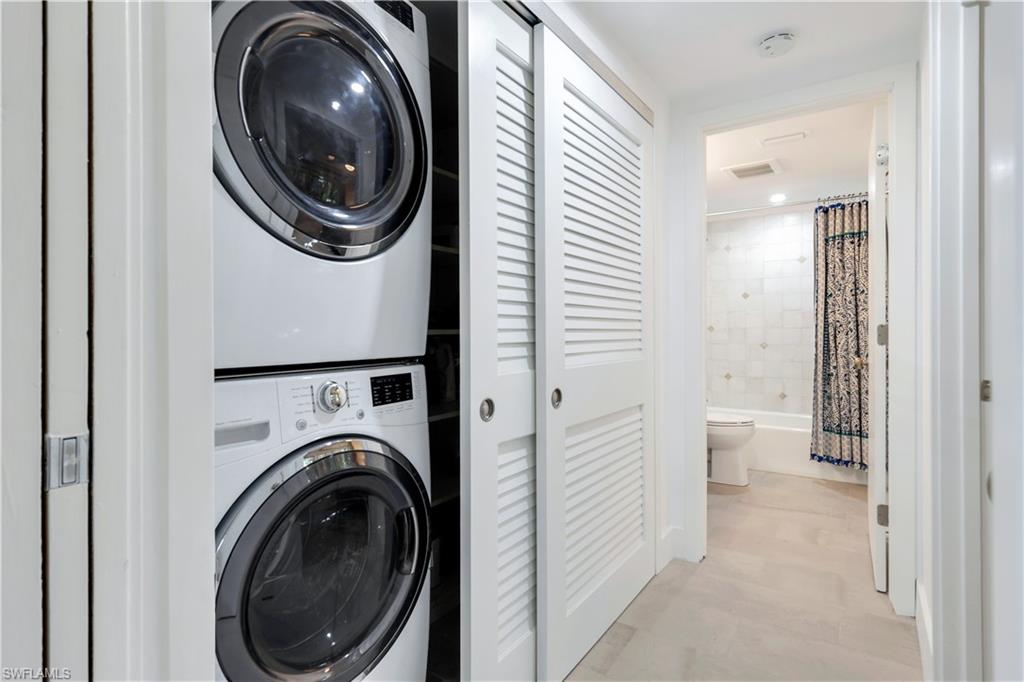 1323 Chesapeake Avenue, Unit 1B Naples, FL 34102 - Photo 14 of 17 a view of a hallway with washer and dryer