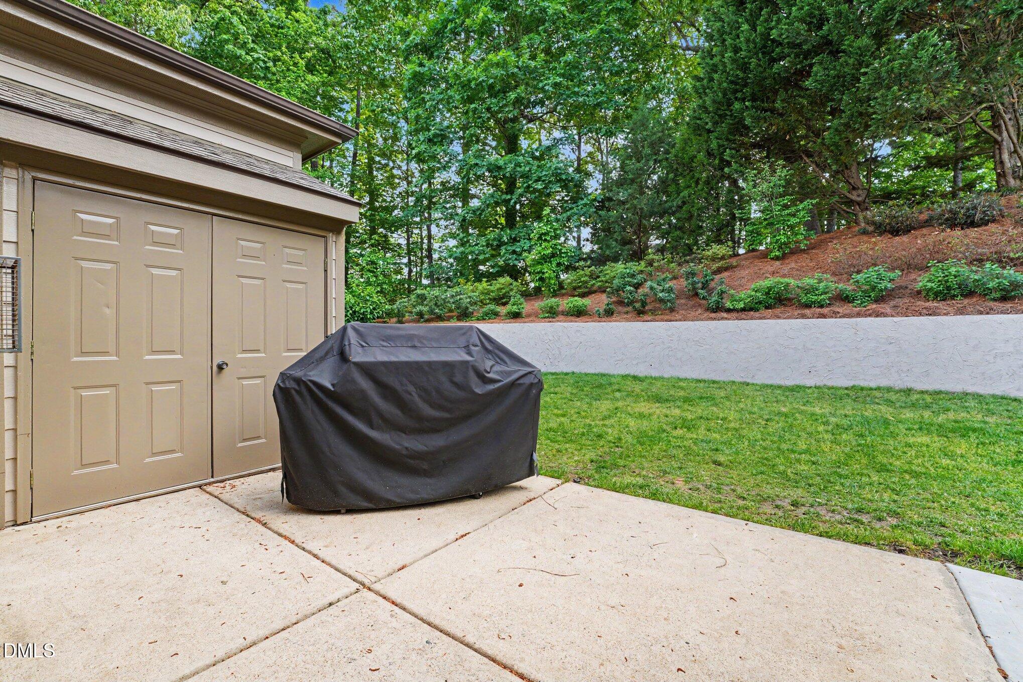 1729 Frenchwood Drive Raleigh, NC 27612 - Photo 41 of 46 a view of backyard with outdoor seating and green space