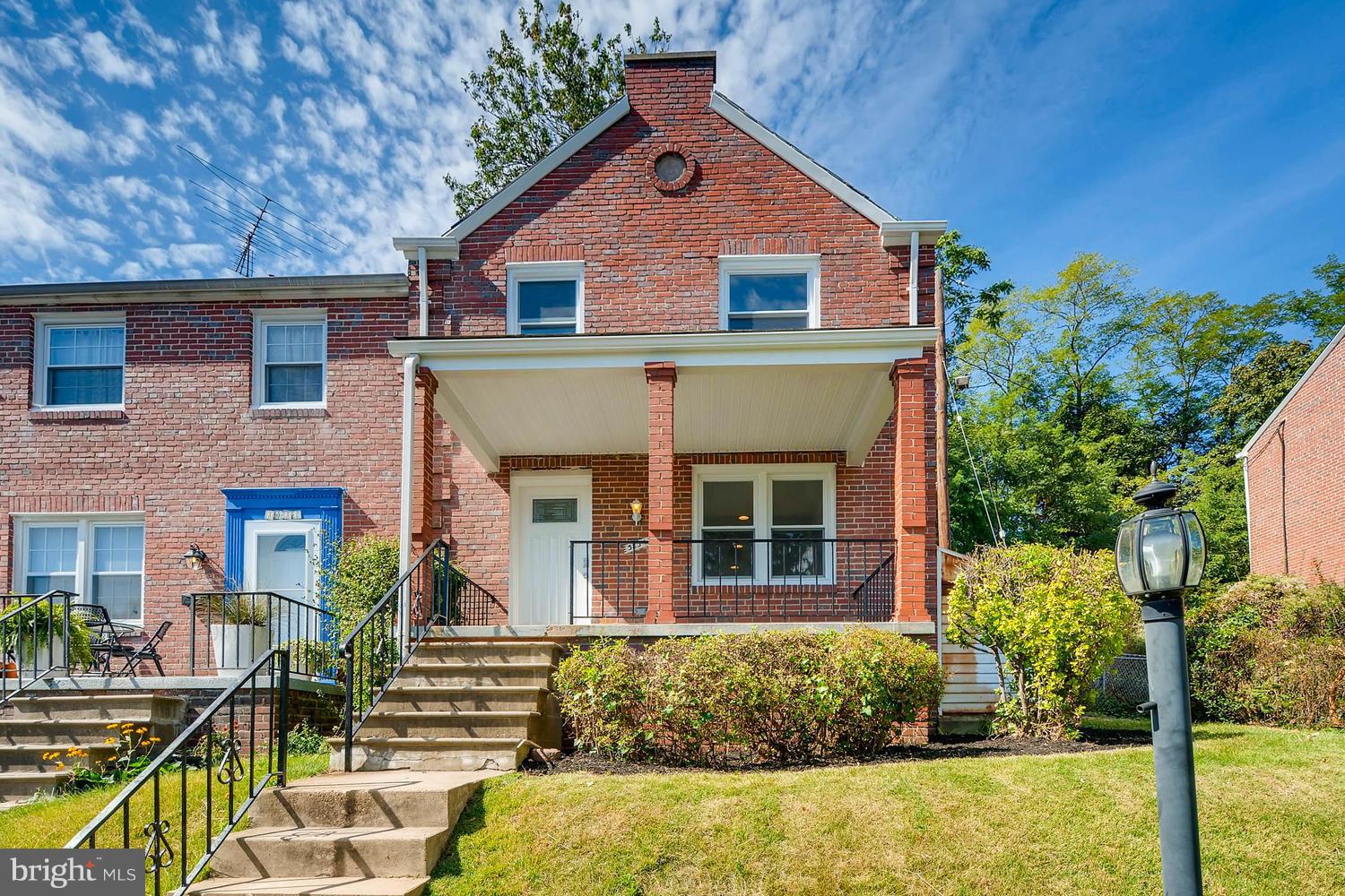 3834 Rexmere Road Baltimore, MD 21218 - Photo 1 of 28 a front view of a house with garden