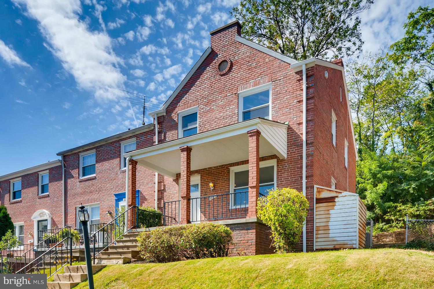 3834 Rexmere Road Baltimore, MD 21218 - Photo 2 of 28 a front view of a house with garden