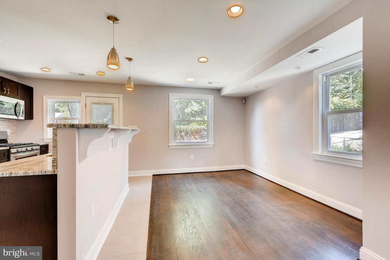 3834 Rexmere Road Baltimore, MD 21218 - Photo 12 of 28 a view of a kitchen with fridge and wooden floor