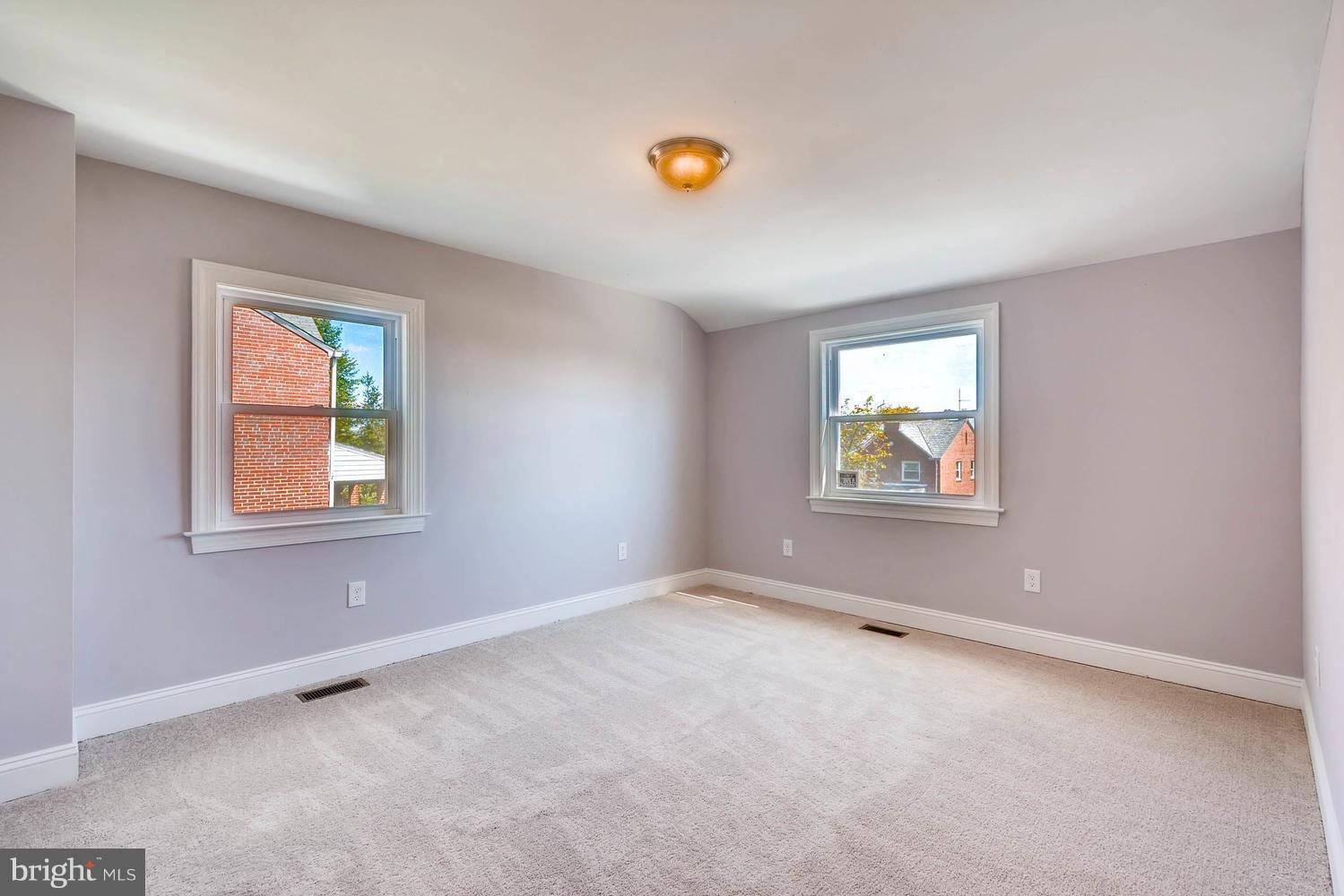 3834 Rexmere Road Baltimore, MD 21218 - Photo 14 of 28 an empty room with windows