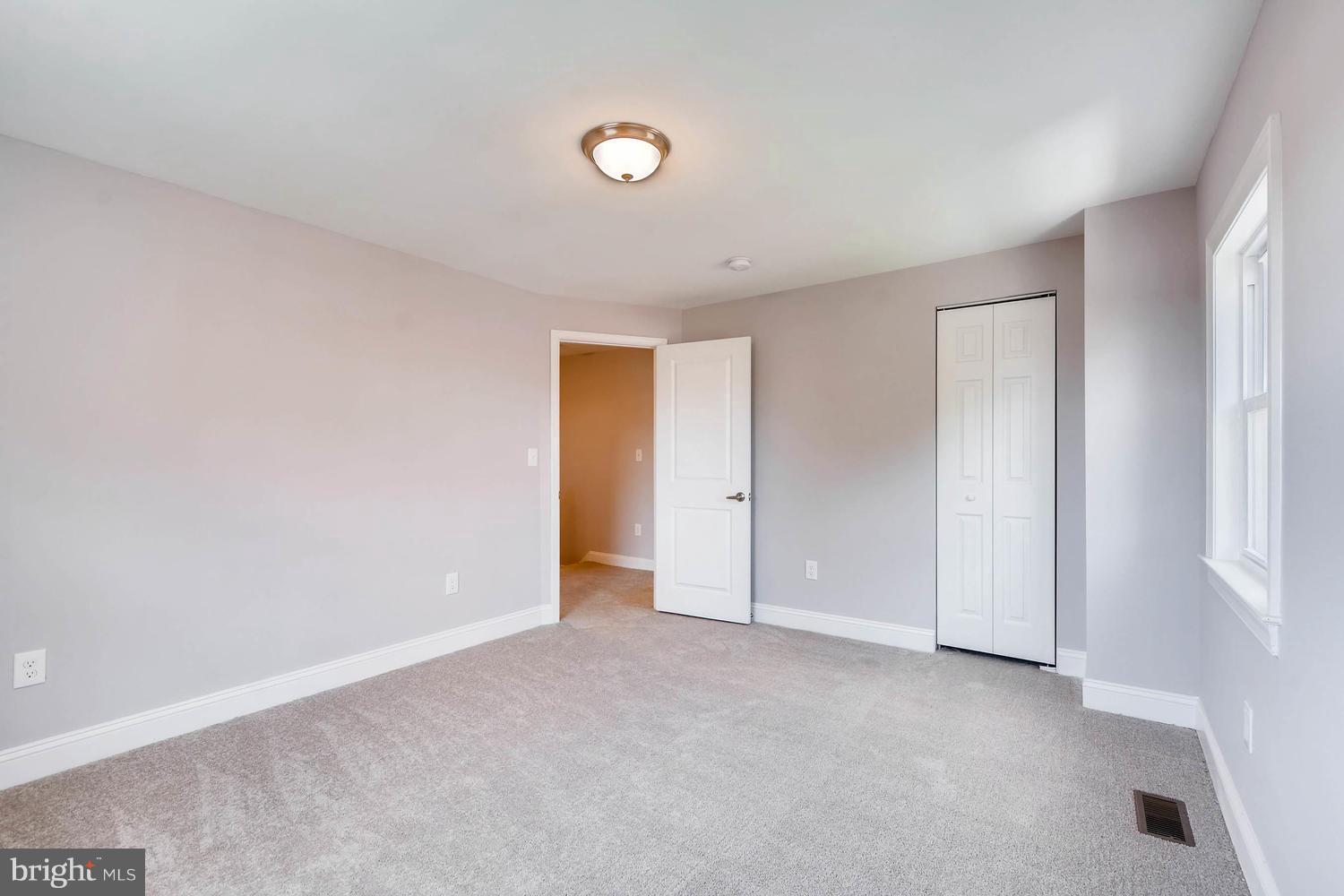 3834 Rexmere Road Baltimore, MD 21218 - Photo 15 of 28 a view of an empty room and a window