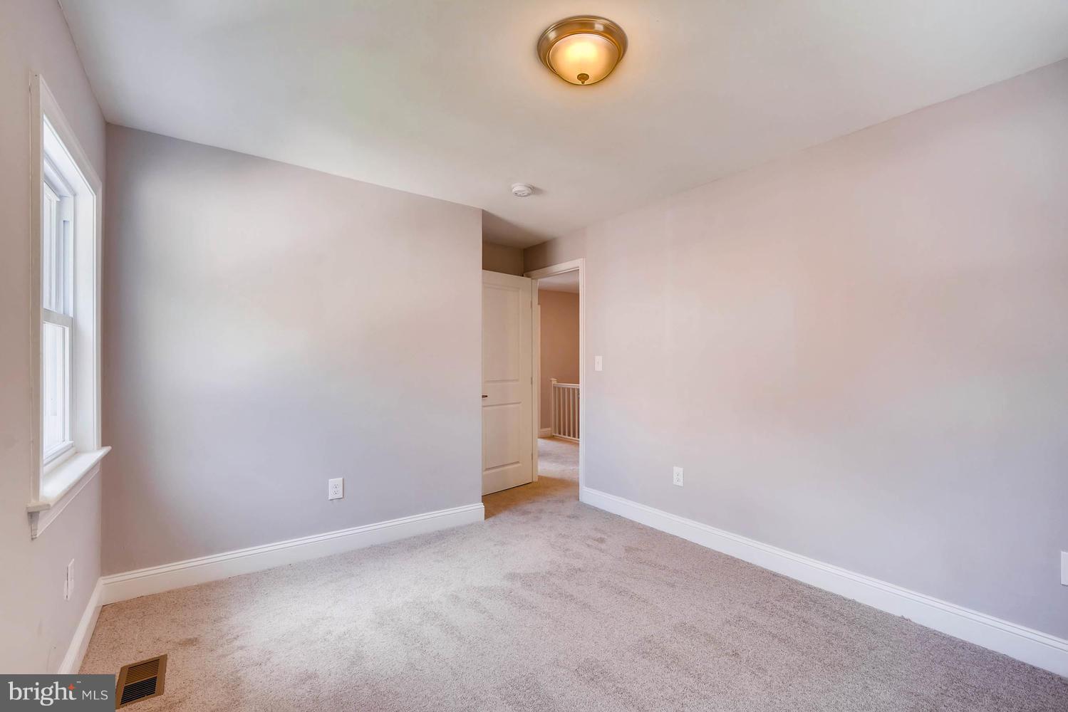 3834 Rexmere Road Baltimore, MD 21218 - Photo 16 of 28 an empty room with a window