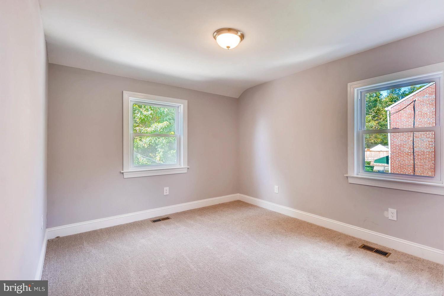 3834 Rexmere Road Baltimore, MD 21218 - Photo 17 of 28 an empty room with windows