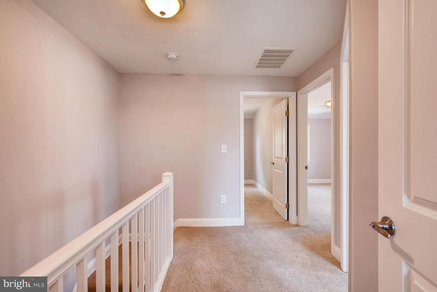 3834 Rexmere Road Baltimore, MD 21218 - Photo 21 of 28 a view of a hallway with wooden floor and entryway