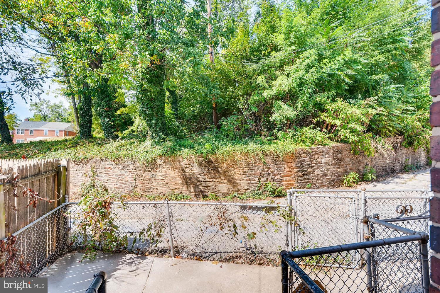 3834 Rexmere Road Baltimore, MD 21218 - Photo 27 of 28 a view of a backyard with wooden fence