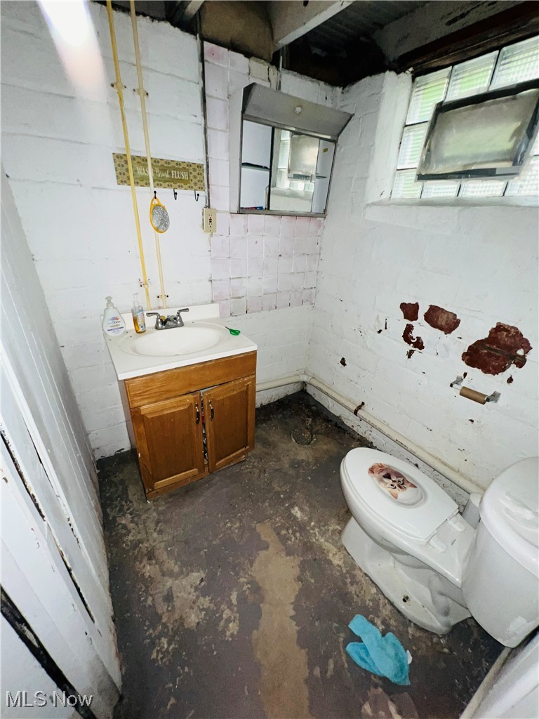 968 Whitby Road Cleveland Heights, OH 44112 - Photo 18 of 19 Half bath with vanity and unfinished concrete floors