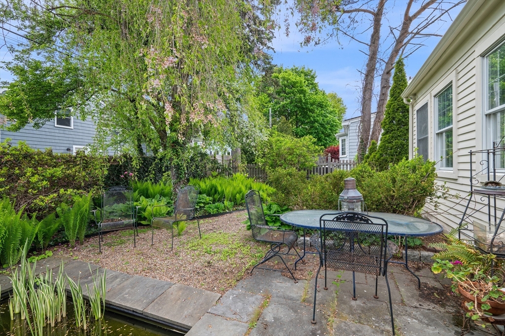 26 Pickwick Road Marblehead, MA 01945 - Photo 33 of 40 a view of patio with table and chairs and potted plants