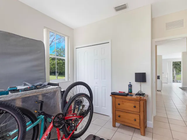 a view of a livingroom with furniture and a window