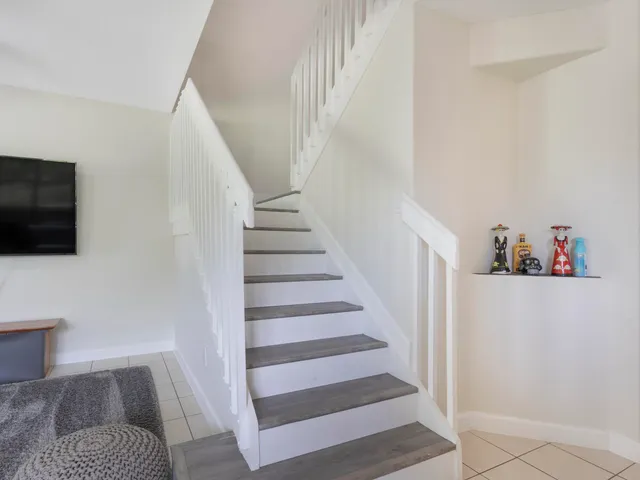 a view of entryway with stairs and wooden floor
