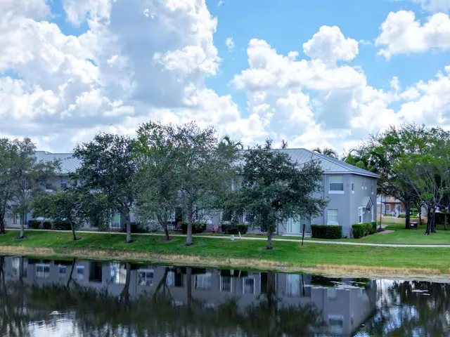 a view of a lake with a house in the background
