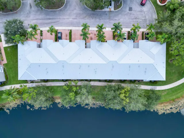 an aerial view of house with yard swimming pool and outdoor seating