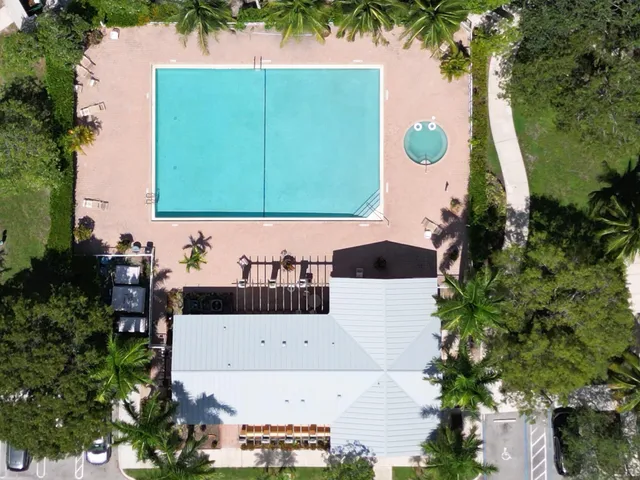 a view of a house with a yard and street