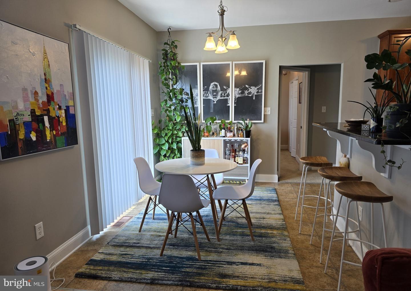 30 Brittingham Drive Dover, DE 19904 - Photo 11 of 36 a view of a dining room with furniture and chandelier