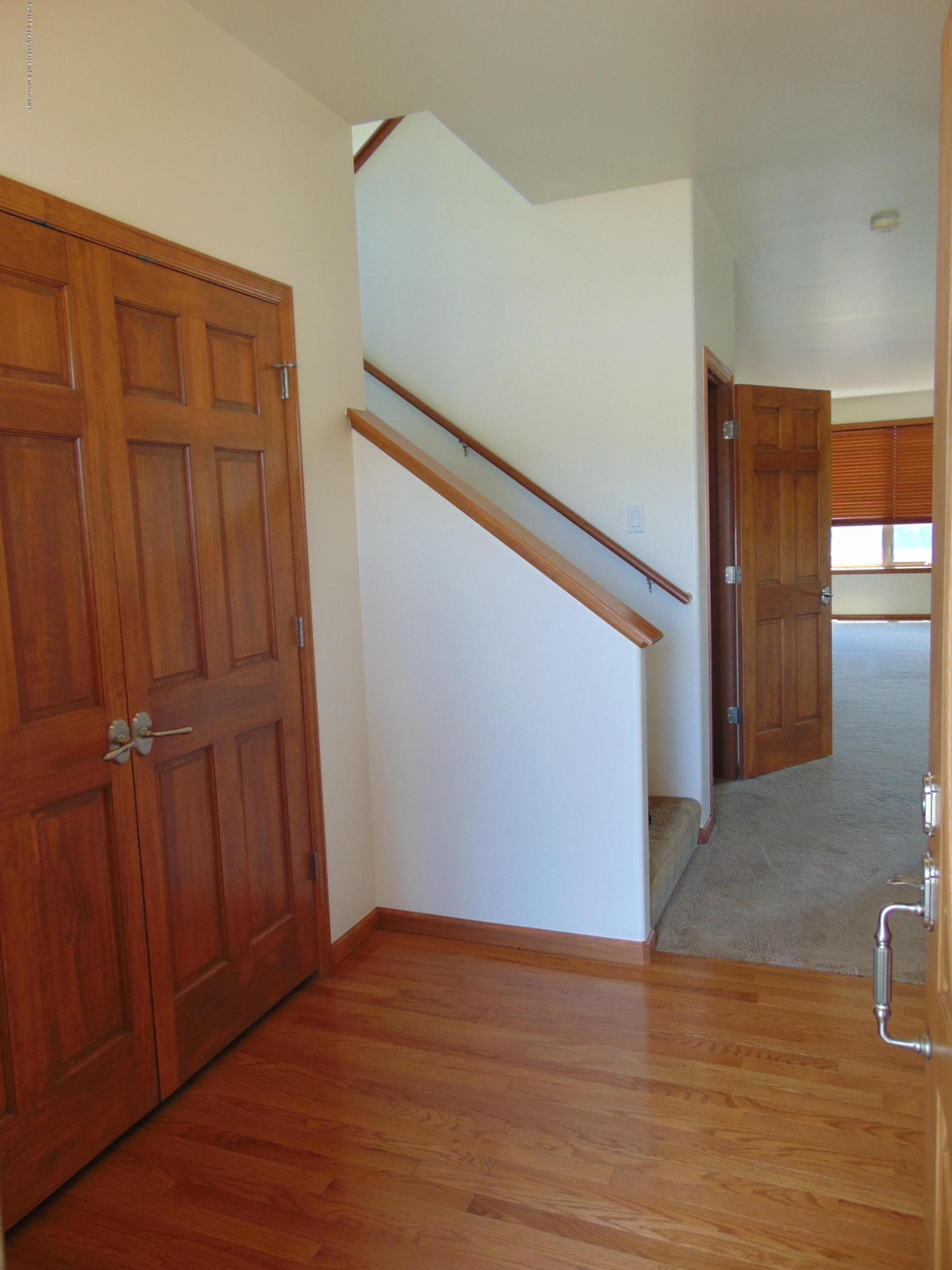 1193 East 19th Street Rifle, CO 81650 - Photo 4 of 40 a view of an empty room with wooden floor