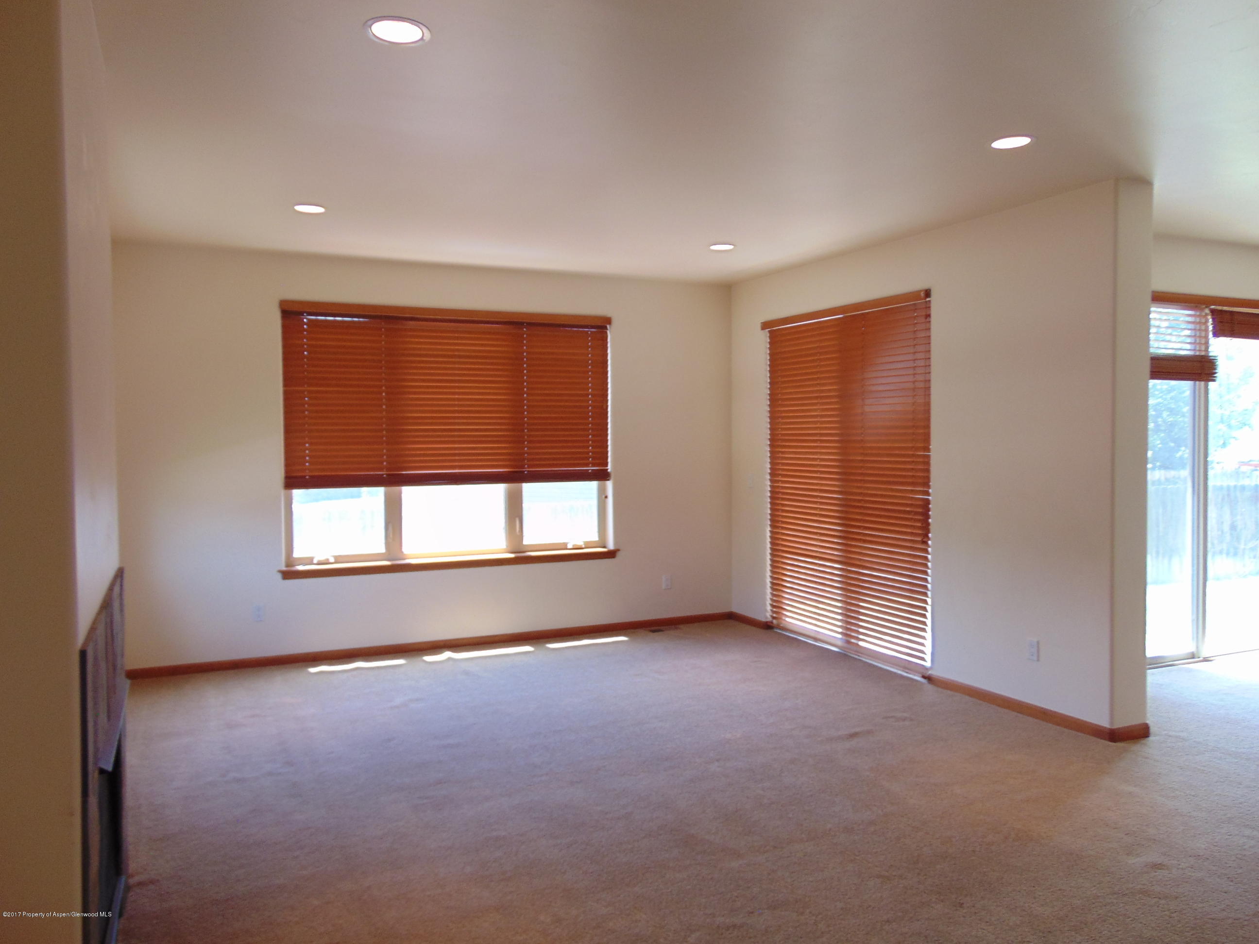 1193 East 19th Street Rifle, CO 81650 - Photo 8 of 40 an empty room with windows