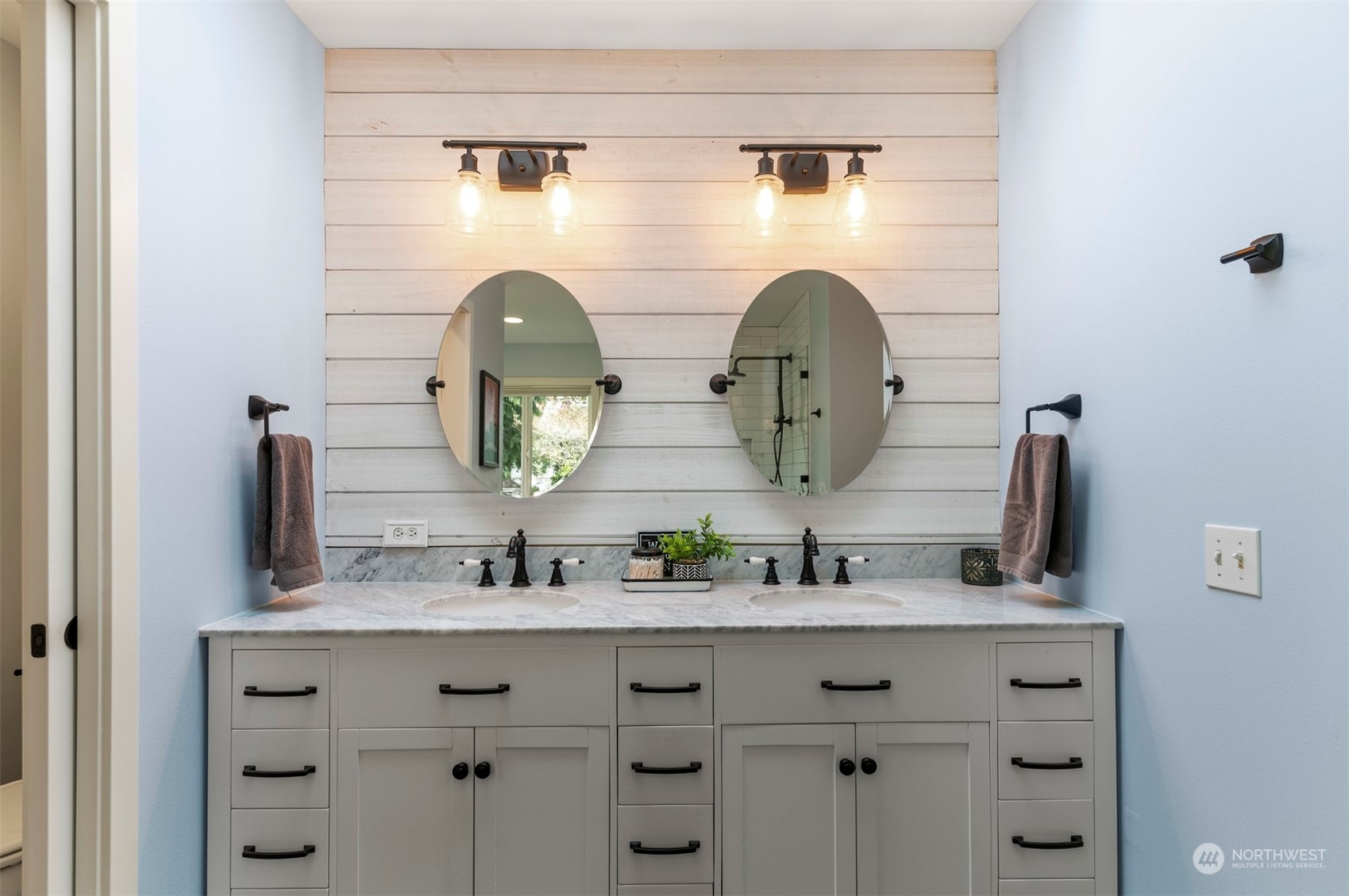 2113 242nd Street Southeast Bothell, WA 98021 - Photo 24 of 38 a bathroom with a double vanity sink and a mirror