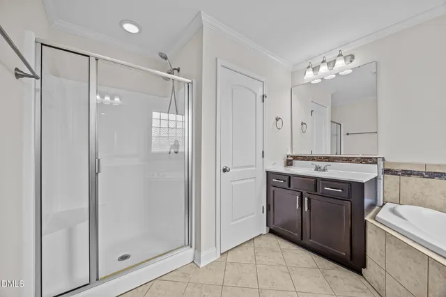 a bathroom with a sink vanity and a mirror
