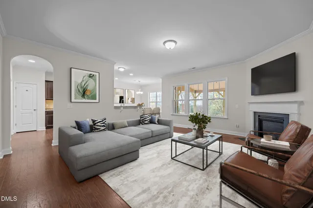 a living room with fireplace furniture and a flat screen tv
