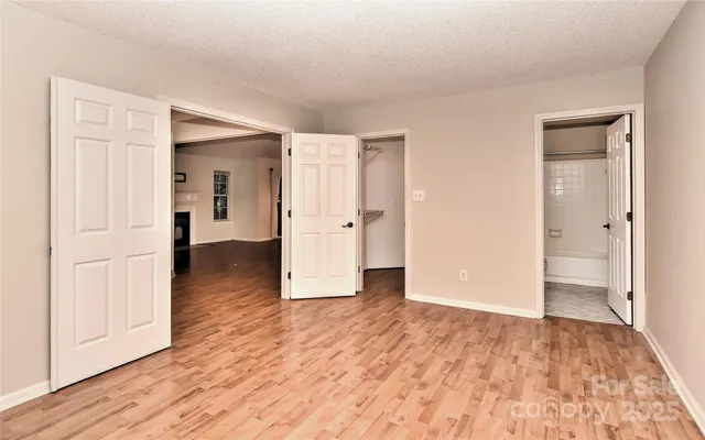 wooden floor with white walls