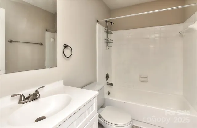 a bathroom with a sink a toilet and a bathtub