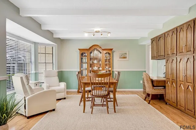 a view of a livingroom with furniture and a chandelier