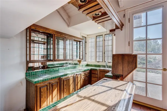 a kitchen with a stove a sink and a refrigerator