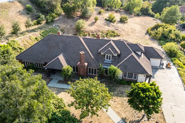 a view of a hallway with wooden floor and entryway