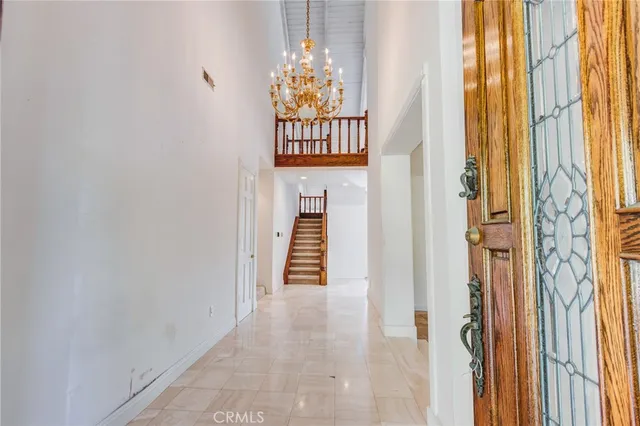 an empty room with a fireplace and window