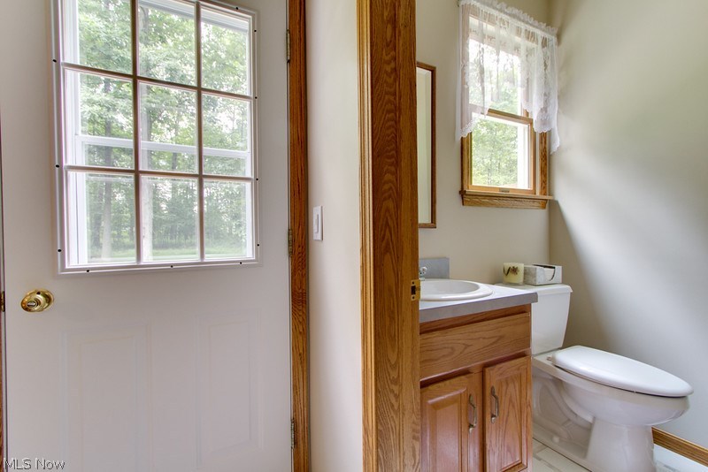 4675 Richman Road Litchfield, OH 44253 - Photo 20 of 30 The half bath is located steps away from the third bedroom.