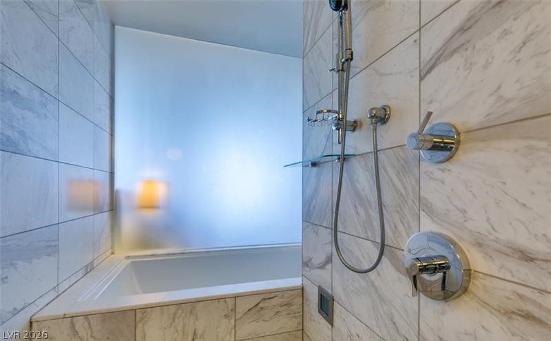 4381 West Flamingo Road, Unit 15310 Las Vegas, NV 89103 - Photo 17 of 52 Bathroom with a bathing tub and tiled shower