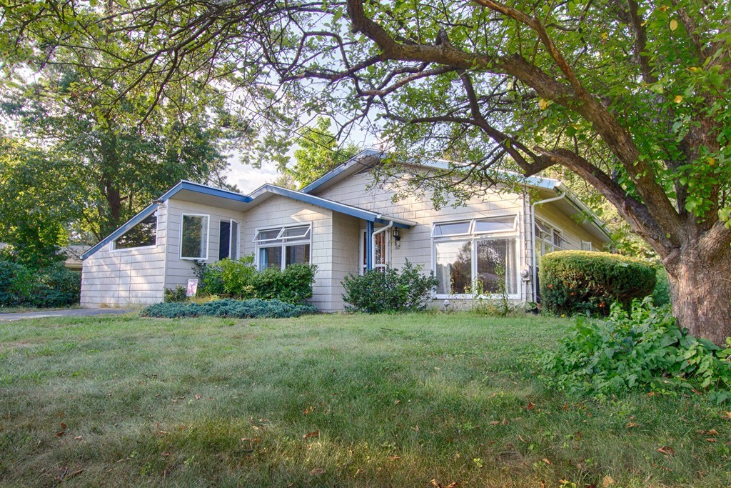 62 Lindsay Road Springfield, MA 01128 - Photo 1 of 27 a front view of a house with a yard and trees