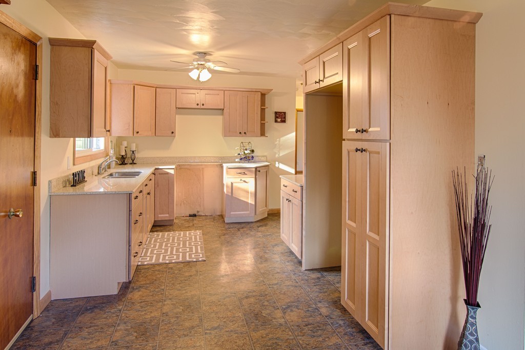 62 Lindsay Road Springfield, MA 01128 - Photo 11 of 27 a kitchen with stainless steel appliances a refrigerator sink and cabinets