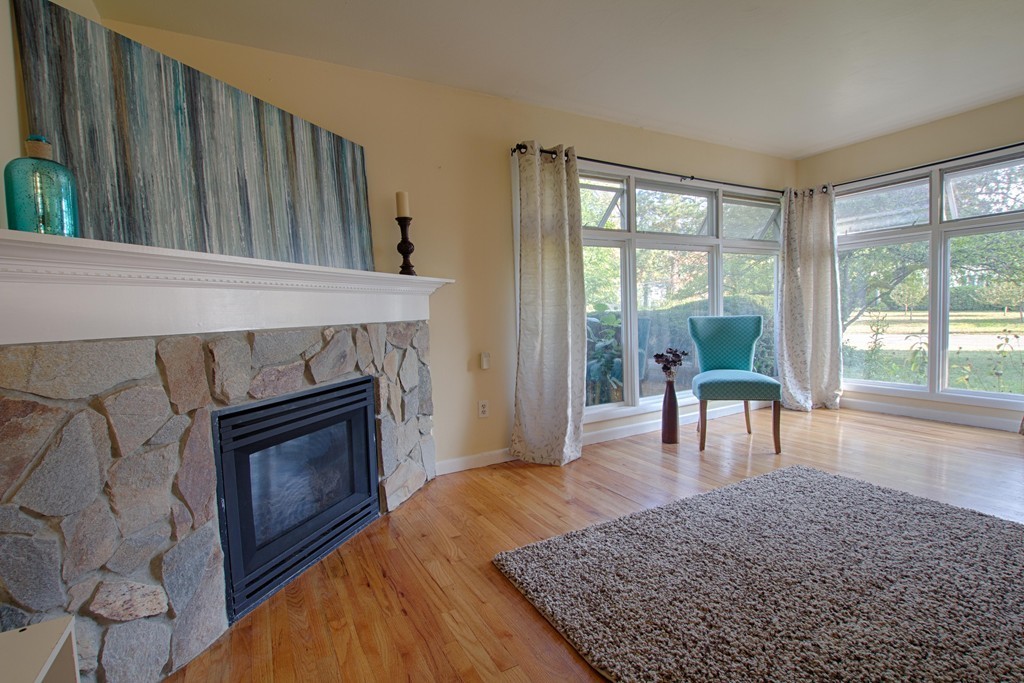 62 Lindsay Road Springfield, MA 01128 - Photo 5 of 27 a living room with furniture and a fireplace