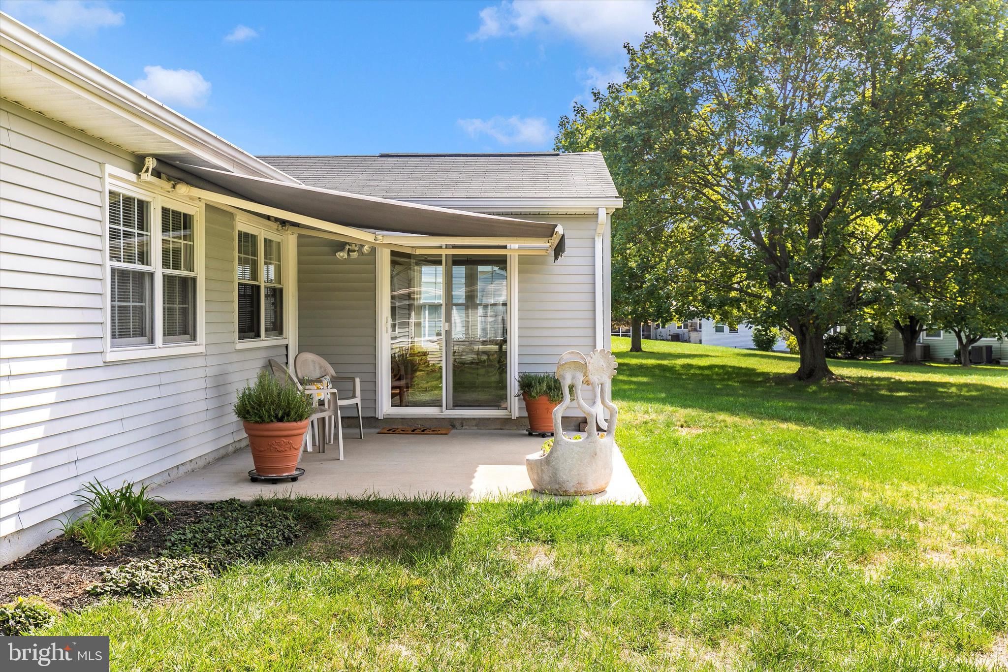 7017 Arbor Drive Frederick, MD 21703 - Photo 36 of 43 Patio with retractable awning