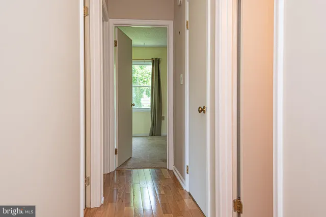a view of a livingroom from a hallway