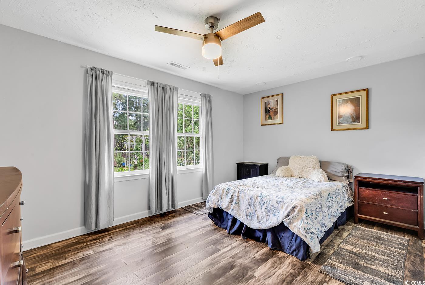 5114 Cowart Court Murrells Inlet, SC 29576 - Photo 18 of 38 Bedroom featuring wood finished floors, baseboards