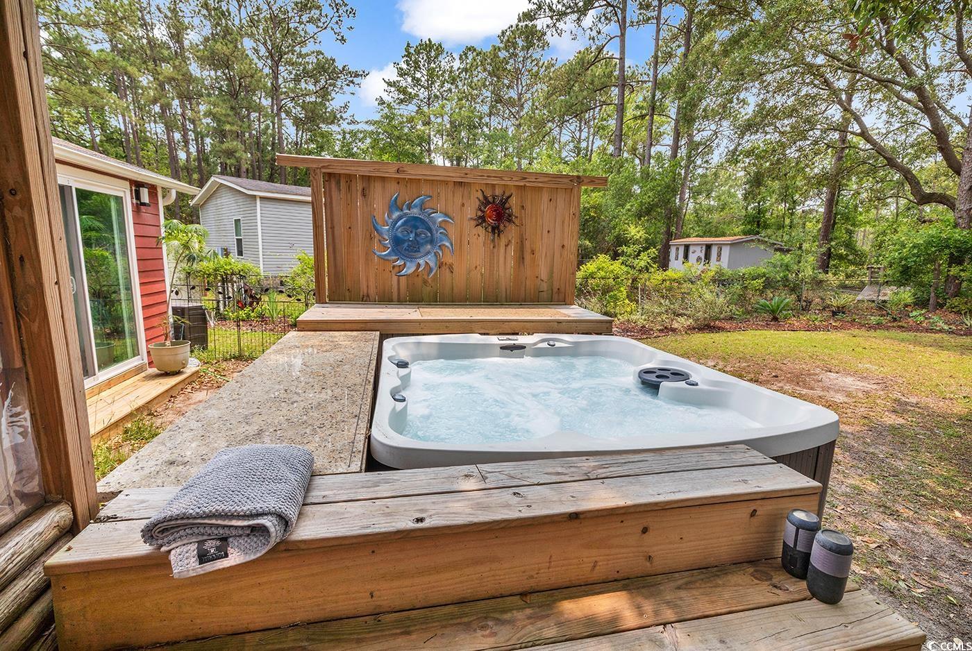 5114 Cowart Court Murrells Inlet, SC 29576 - Photo 22 of 38 Wooden deck featuring an outdoor hot tub