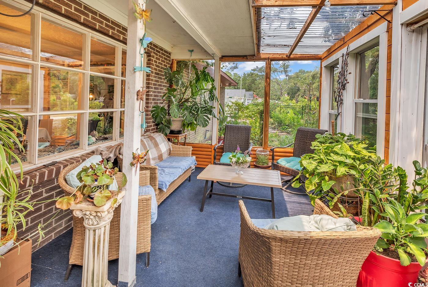 Sunroom with an outdoor living space