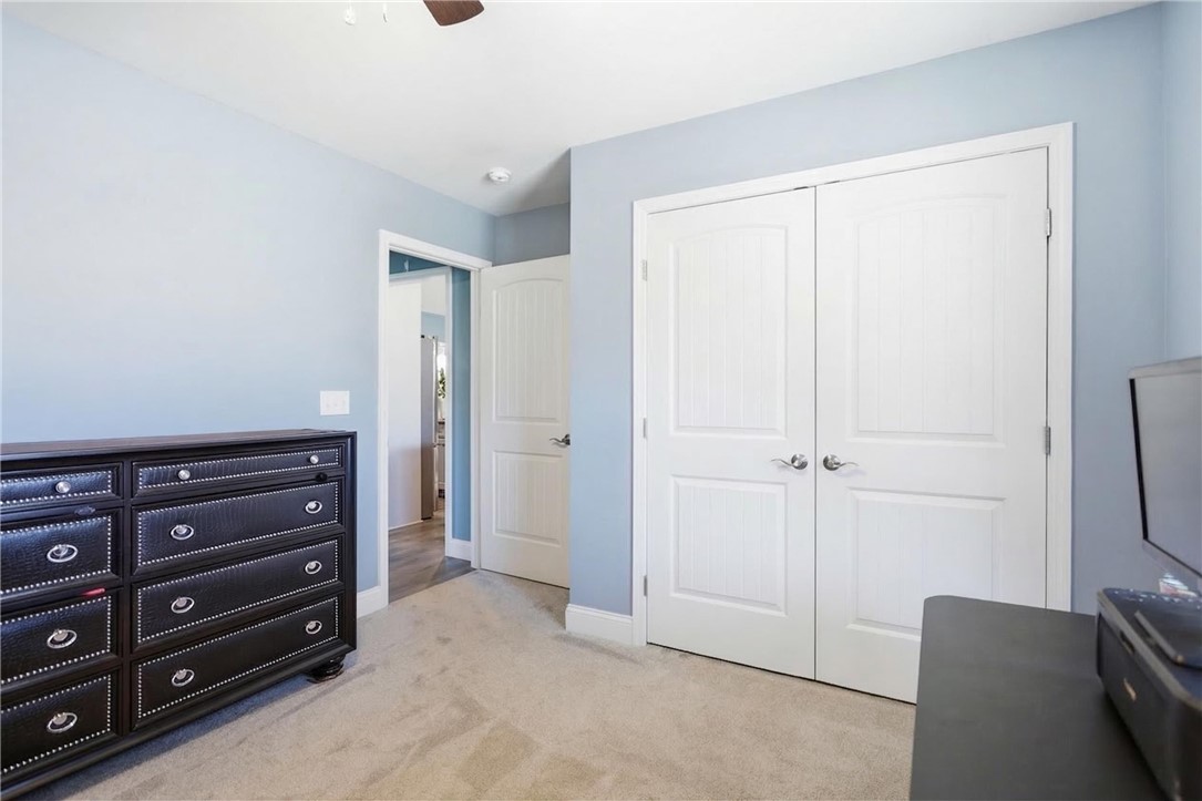 745 Dave Nix Road Seneca, SC 29678 - Photo 18 of 23 A well-lit bedroom with soft carpeting and functional closet doors offers comfortable living.