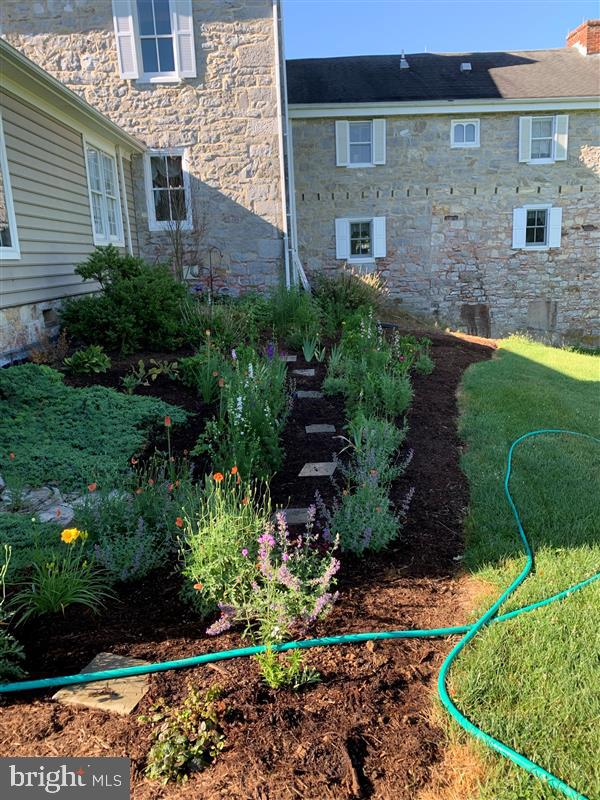 1-22020 Durberry Road Smithsburg, MD 21783 - Photo 125 of 138 a view of a brick house with a yard and potted plants