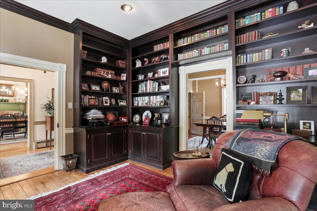 1-22020 Durberry Road Smithsburg, MD 21783 - Photo 51 of 138 a living room with furniture a rug and a book shelf