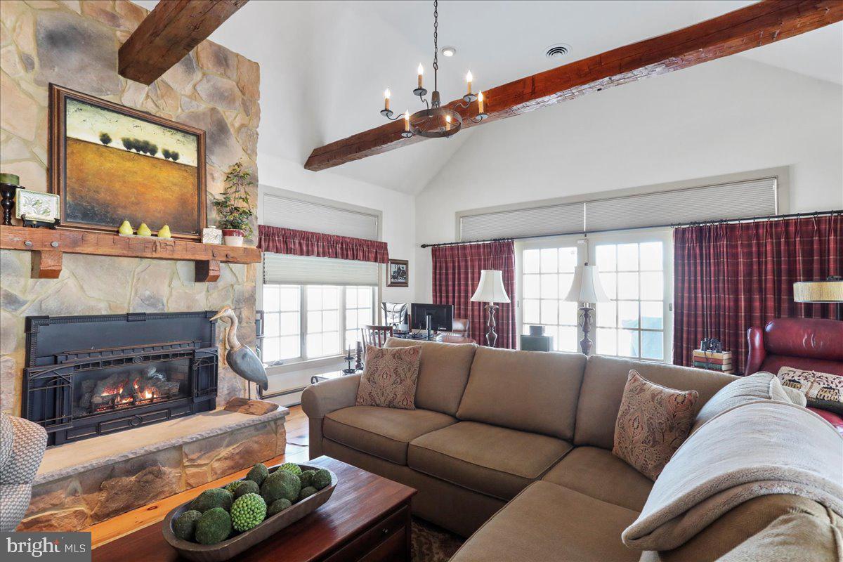 1-22020 Durberry Road Smithsburg, MD 21783 - Photo 72 of 138 a living room with furniture a fireplace and a large window