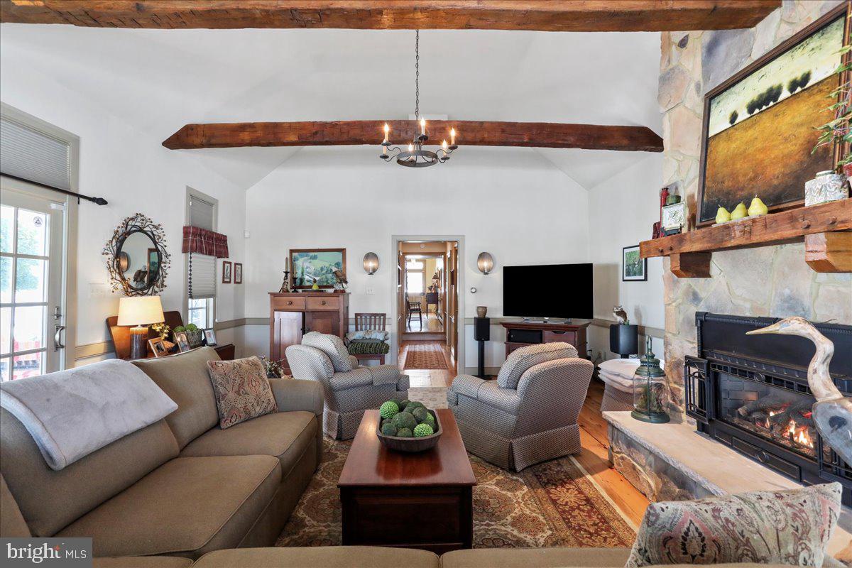 1-22020 Durberry Road Smithsburg, MD 21783 - Photo 75 of 138 a living room with furniture a flat screen tv and a fireplace