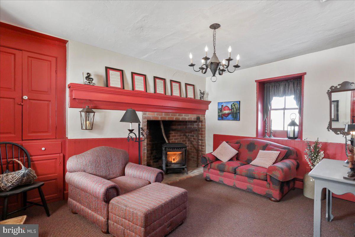 1-22020 Durberry Road Smithsburg, MD 21783 - Photo 95 of 138 a living room with furniture a fireplace and a chandelier